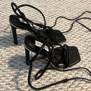 Very cute, black Steve Madden strappy heals with silver detailing